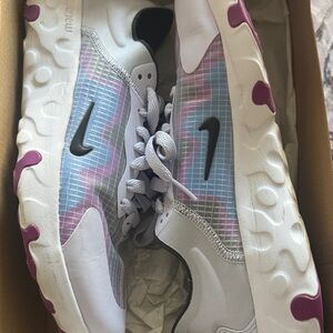 Nike White and Pink Sneakers with Black Logo